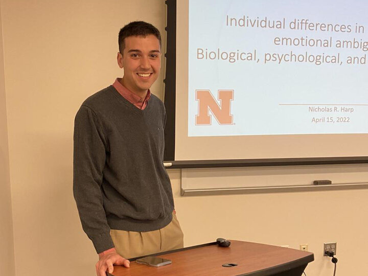 Dr Nick Harp in front of his thesis presentation